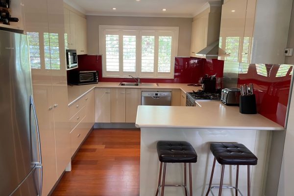 Old kitchen with red splashback