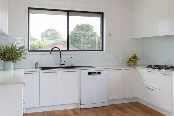 White shaker cabinetry in this u shaped kitchen