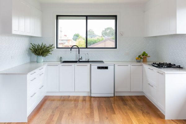 white kitchen with pressed tin splashback