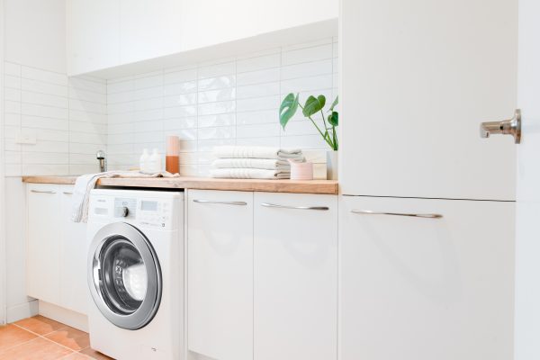 White and timber benchtops flatpack laundry